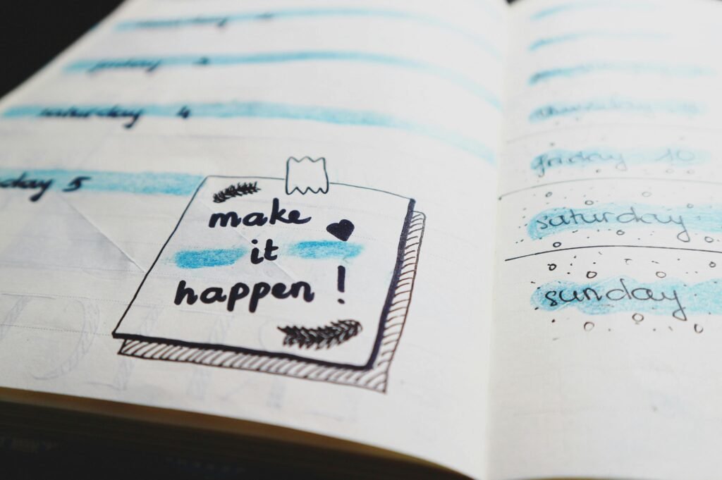 pexels-photo-669986-669986 Close-up view of a planner page with motivational text and colorful designs.